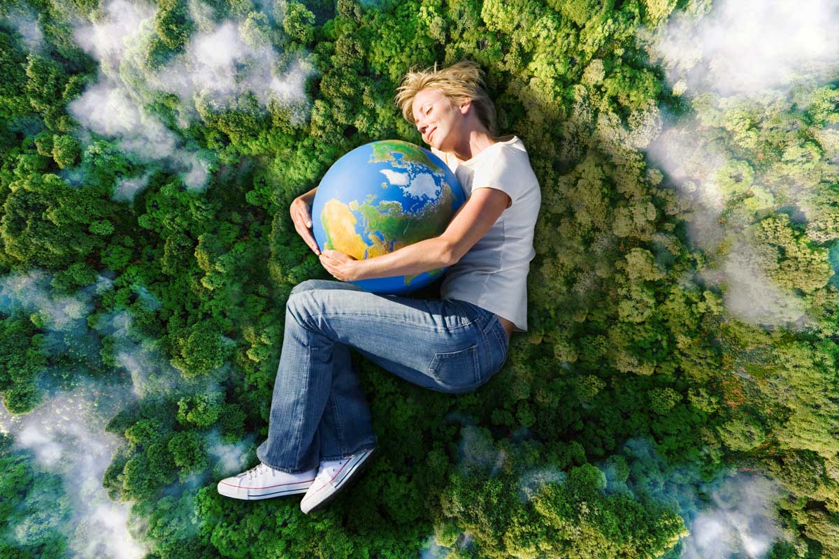 Woman hugging the planet earth