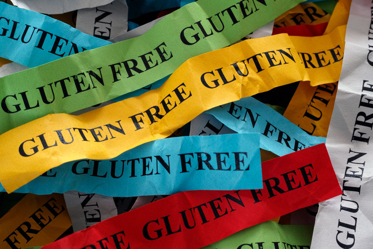 What is gluten, where is it found, and what does it do to the body?